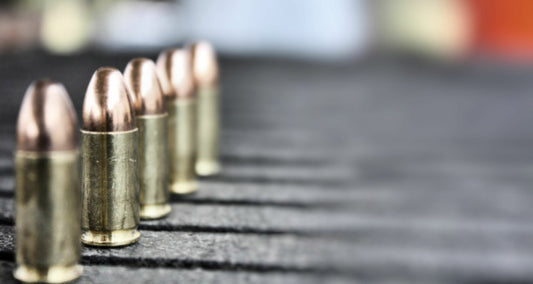 Rounds of 9mm on a table. 