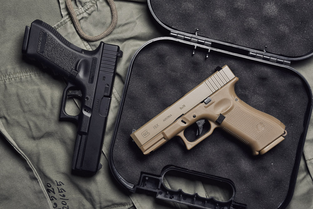 Glock firearms colored black and FDE